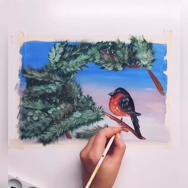 Снегирь на заснеженной ветке