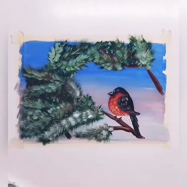 Снегирь на заснеженной ветке