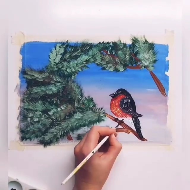 Снегирь на заснеженной ветке