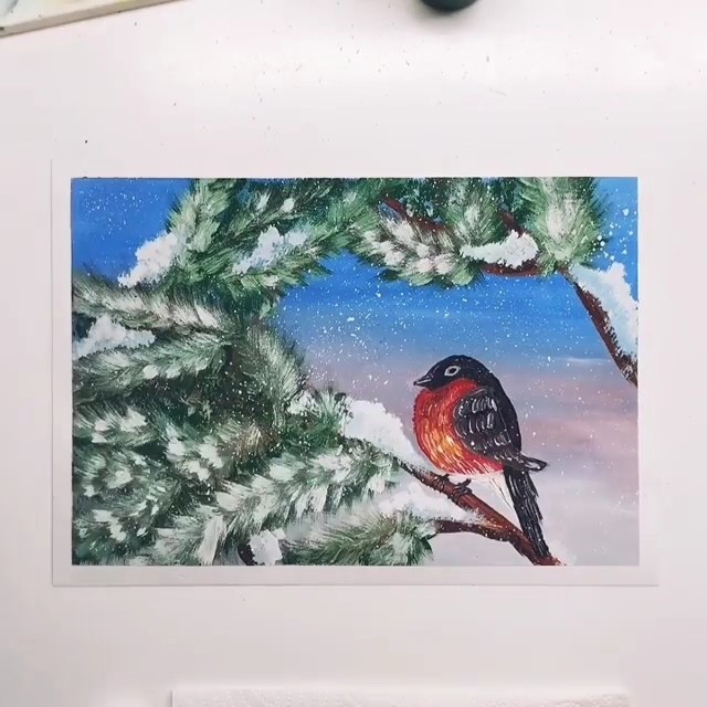 Снегирь на заснеженной ветке