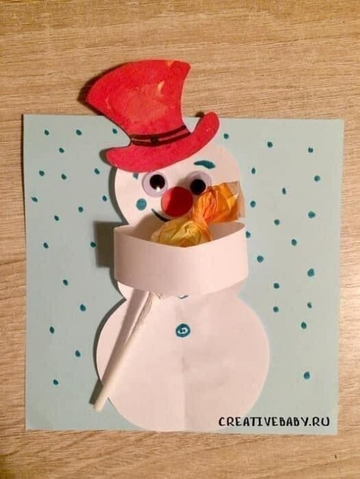 ​Снеговик с конфетой на палочке
